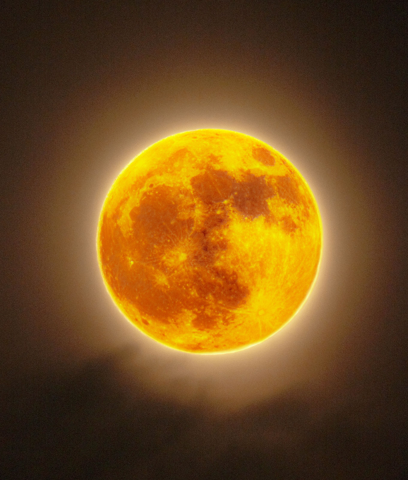 The Strawberry Moon of 2024 shines through the clouds. This is an HDR image composite created using high and low shutter speeds to capture both the bright surface of the moon and the dim surrounding clouds in one picture, taken through the Tokina SZ 900mm mirror lens. The lens is mounted on a Fuji XT-2 body, with a 1/30 second exposure for the dim cloud background and 1/400 second for the bright moon surface at ISO200.